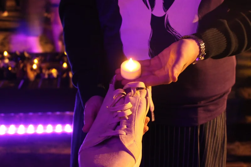 Image-1-Candles-lit-and-laid-alongside-shoes-for-victims-of-Domestic-and-Family-Violence-1-scaled.jpg