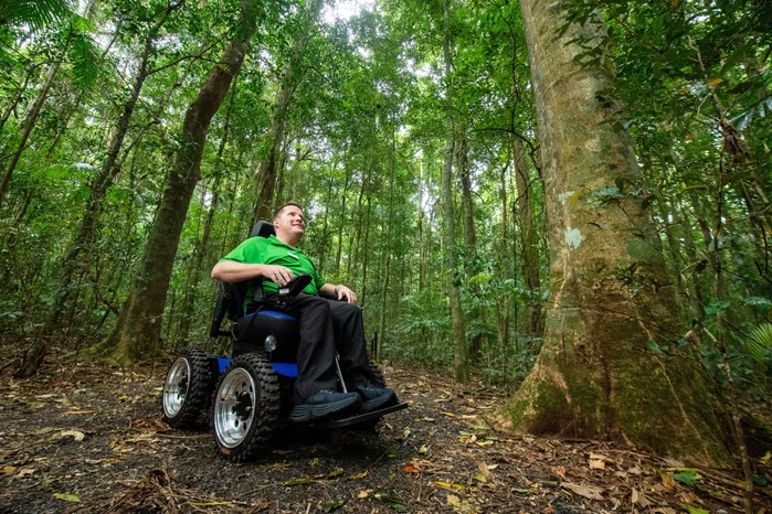 Brendan Somerville, Spinal Life Australia Small Business Inclusion Mentor exploring the wonders of Mary Cairncross Scenic Reserve in the new 4WD wheelchair.