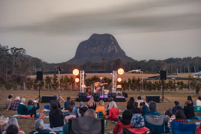 Lior playing at Bankfoot House Heritage Precinct during Horizon Festival. Mt Tibrogargan is in the background