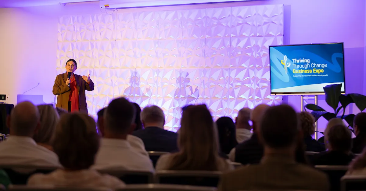 One of the business speakers on stage at the Thriving Through Change event.
