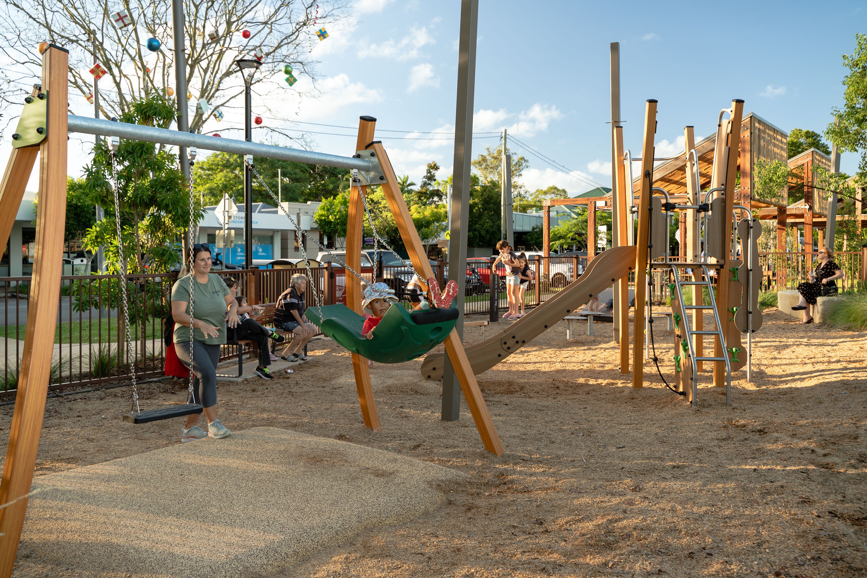 People enjoying the new playground at the Community Event to celebrate the completion of the Cribb Street Streetscape, Landsborough.