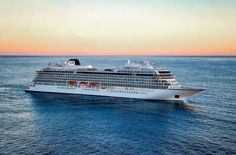 Viking Orion cruise ship sailing at sunrise