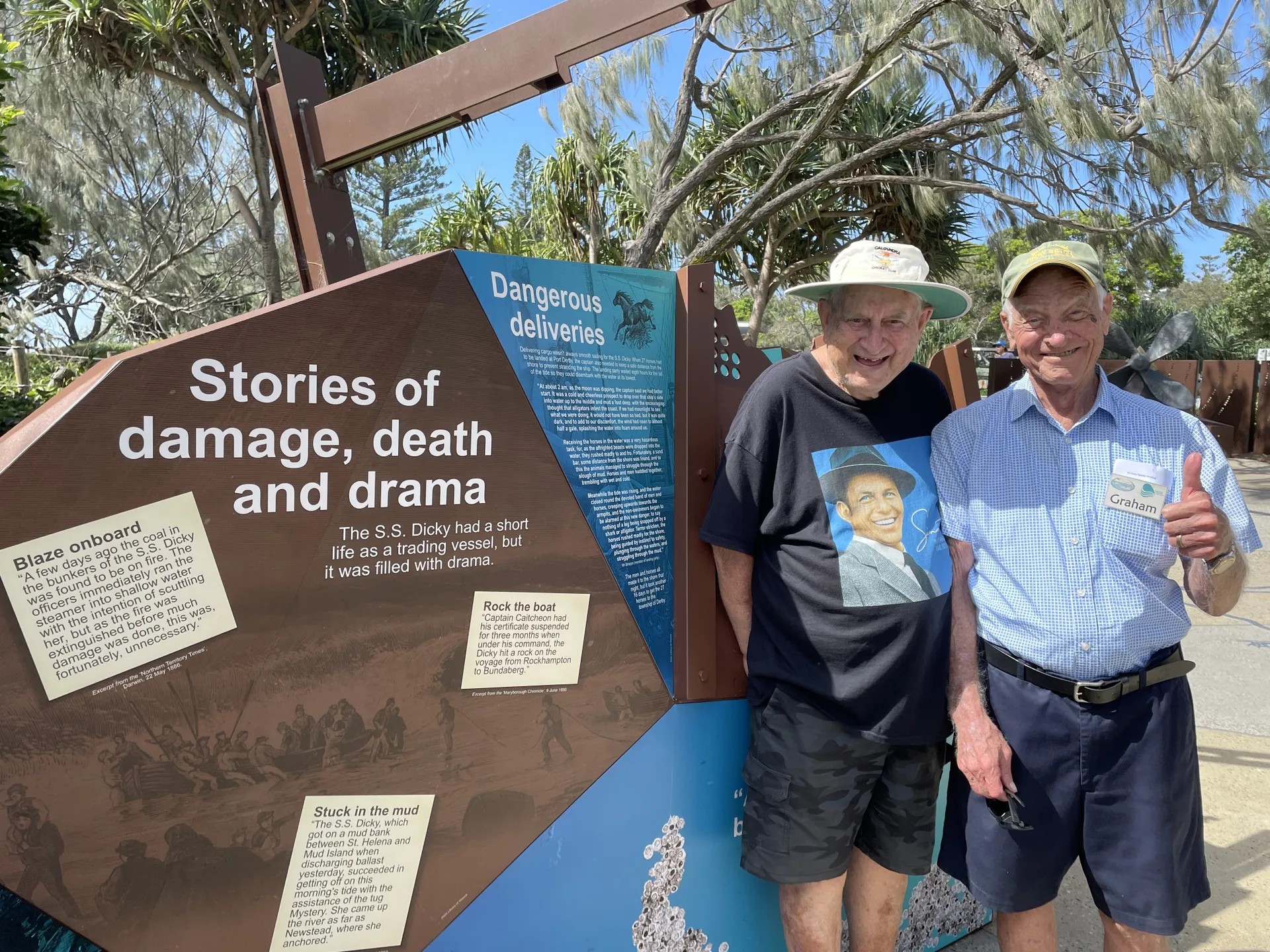 Long time locals Colin White (left) and Graham Smith, members of the S.S. Dicky Taskforce, inspect the new interpretive signage and wreck pieces of the S.S. Dicky