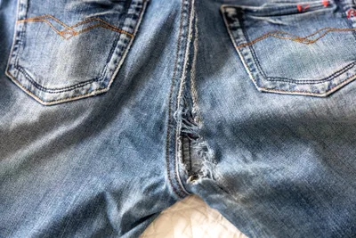 Jeans with a rip in the crotch area