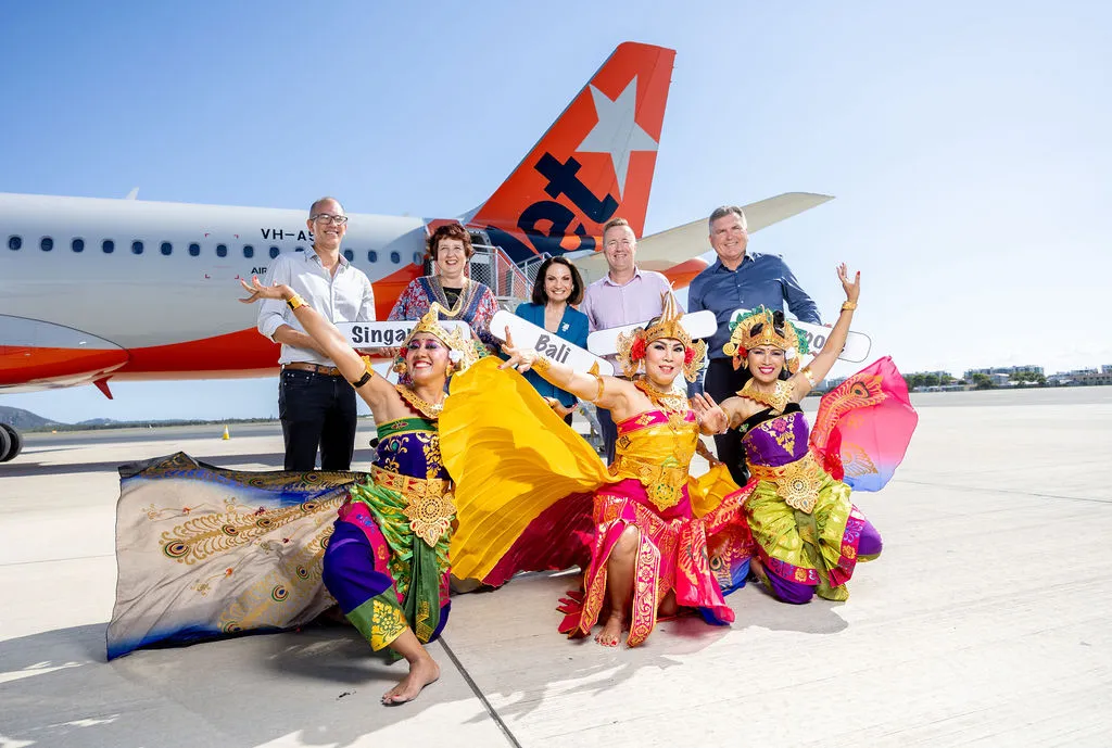 Mayor Rosanna Natoli and other stakeholders with Balinese dancers in front of a Jetstar plane at Sunshine Coast Airport