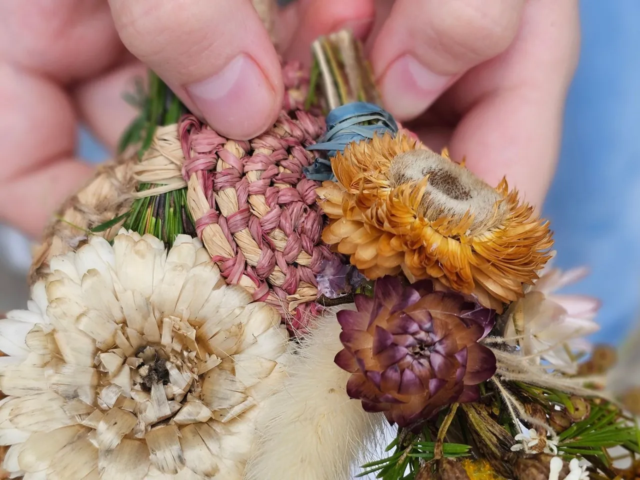 Native Flower wristband workshop. Colourful dried flowers tied together.