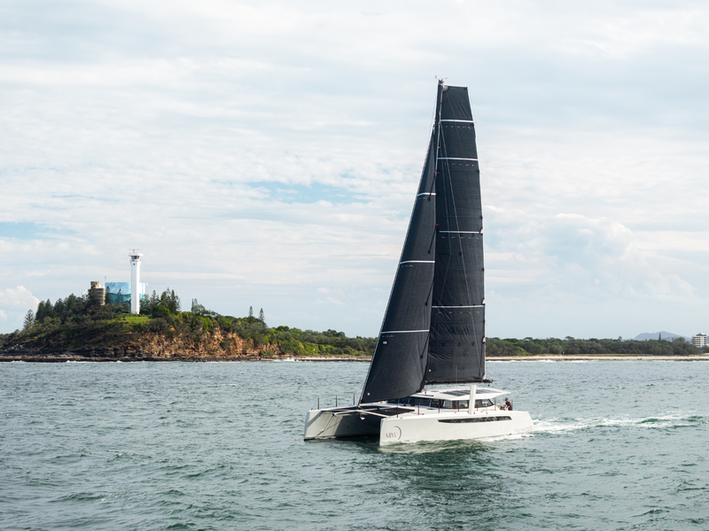 Cure Marine Cure 55 catamaran Miyu. On the water lighthouse in the distance.