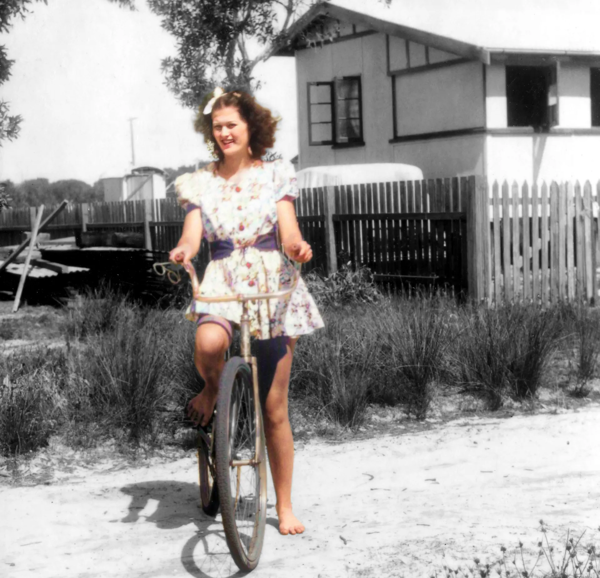 Leonie-Neil-from-Alexandra-Headland-submitted-an-image-of-Jean-Evans-on-her-pushbike-outside-the-family-house_Cotton-Tree_1939-scaled.jpg
