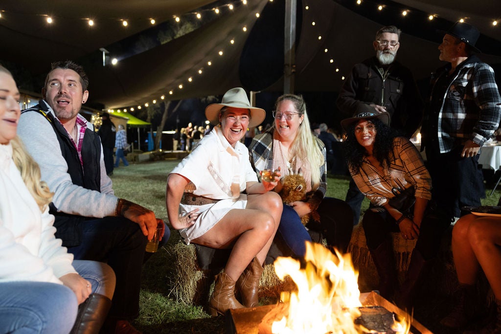 People sitting around a firepit