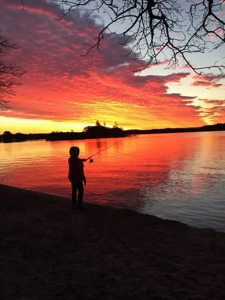 Shadowy figure fishing on Chambers Island in Maroochydore at sunset