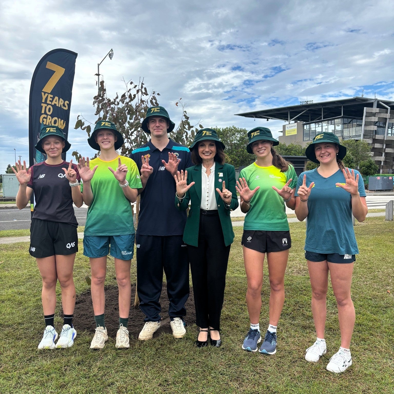 Mayor and students at tree planting ceremony. 