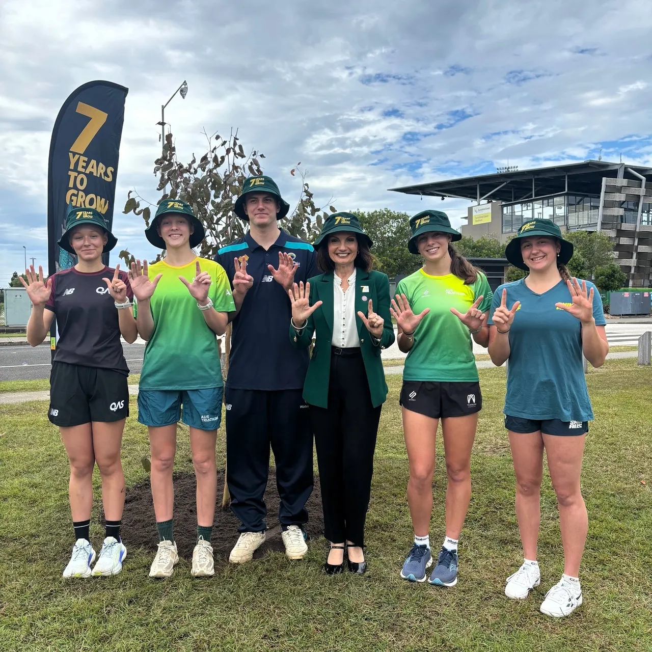 Mayor and students at tree planting ceremony.