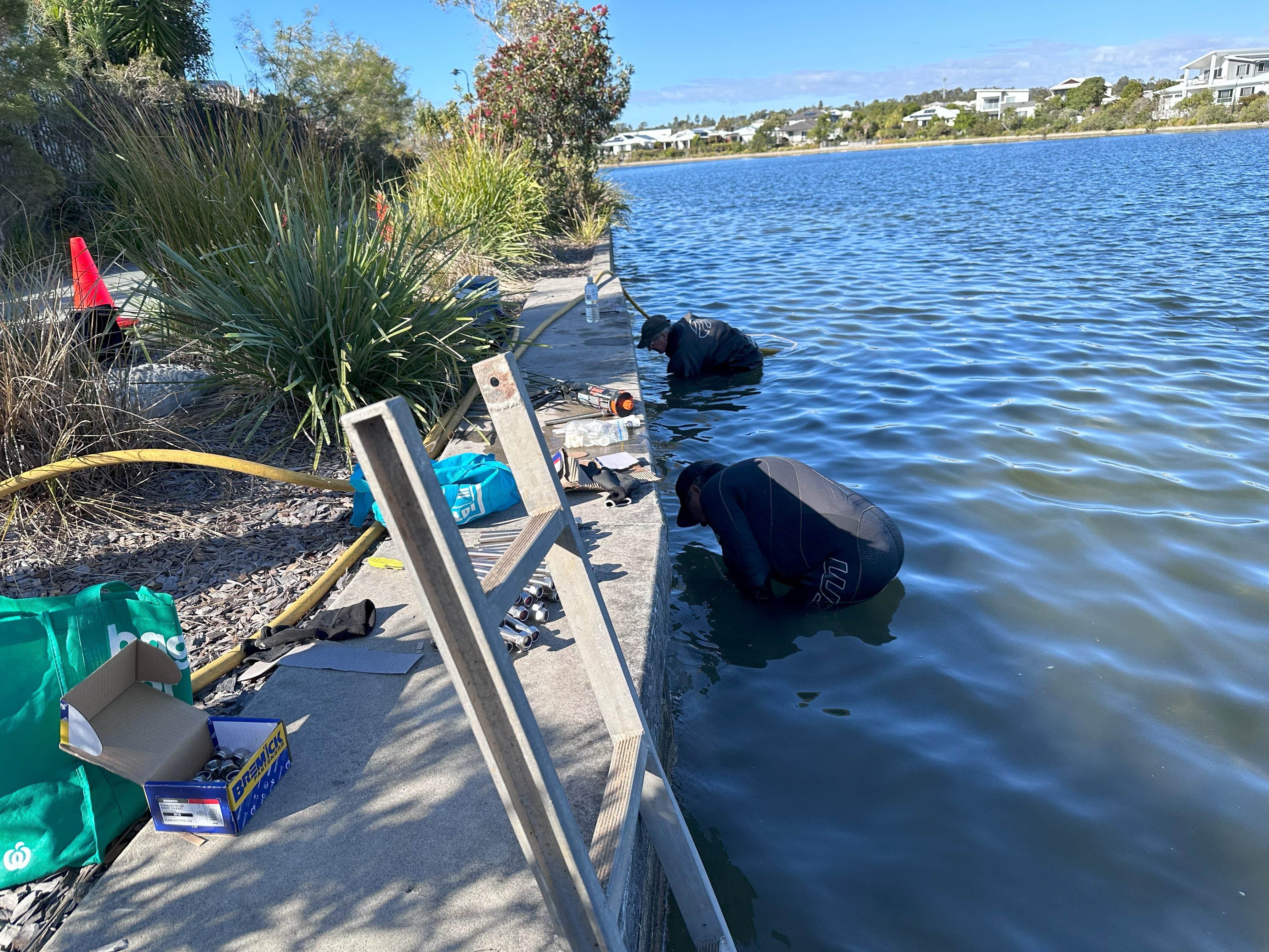 Living seawall breathing new life into lake - Divers installing ‘living seawall’ panels.