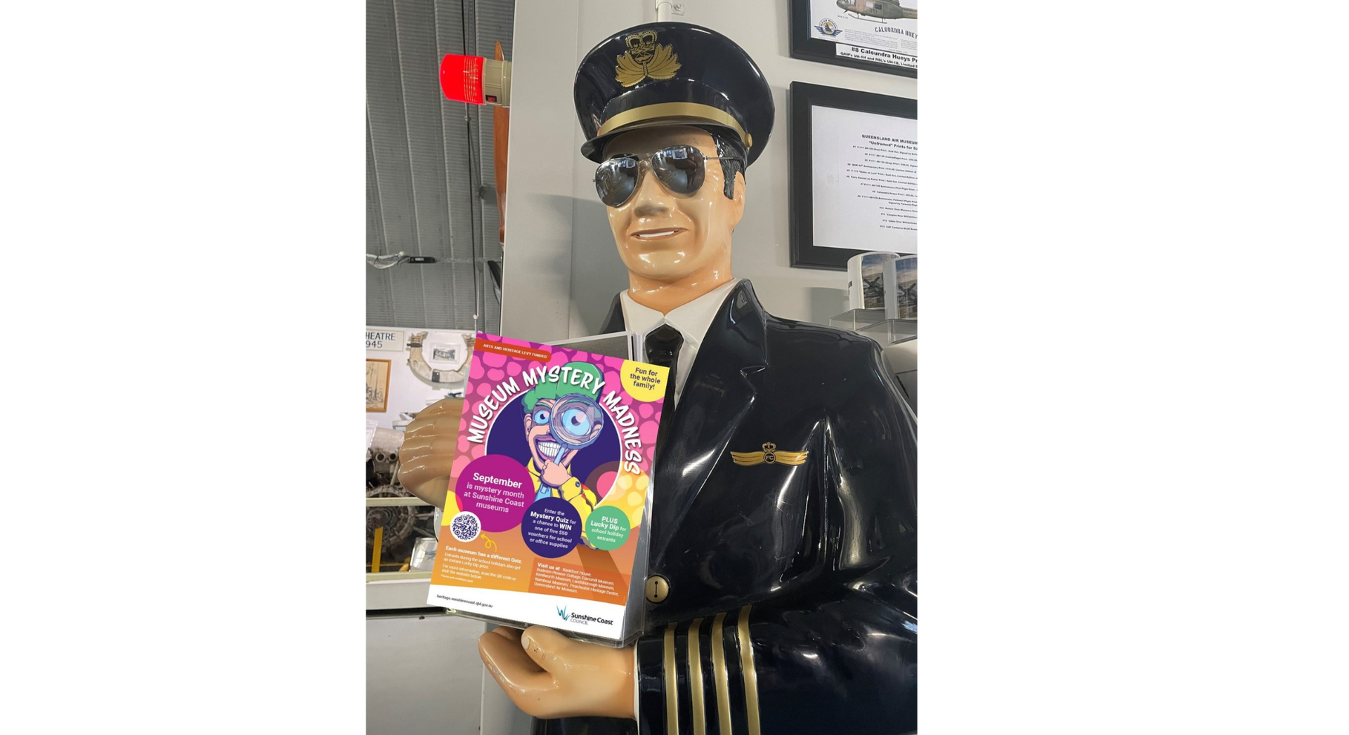 Queensland Air Museum model pilot holding a quiz box