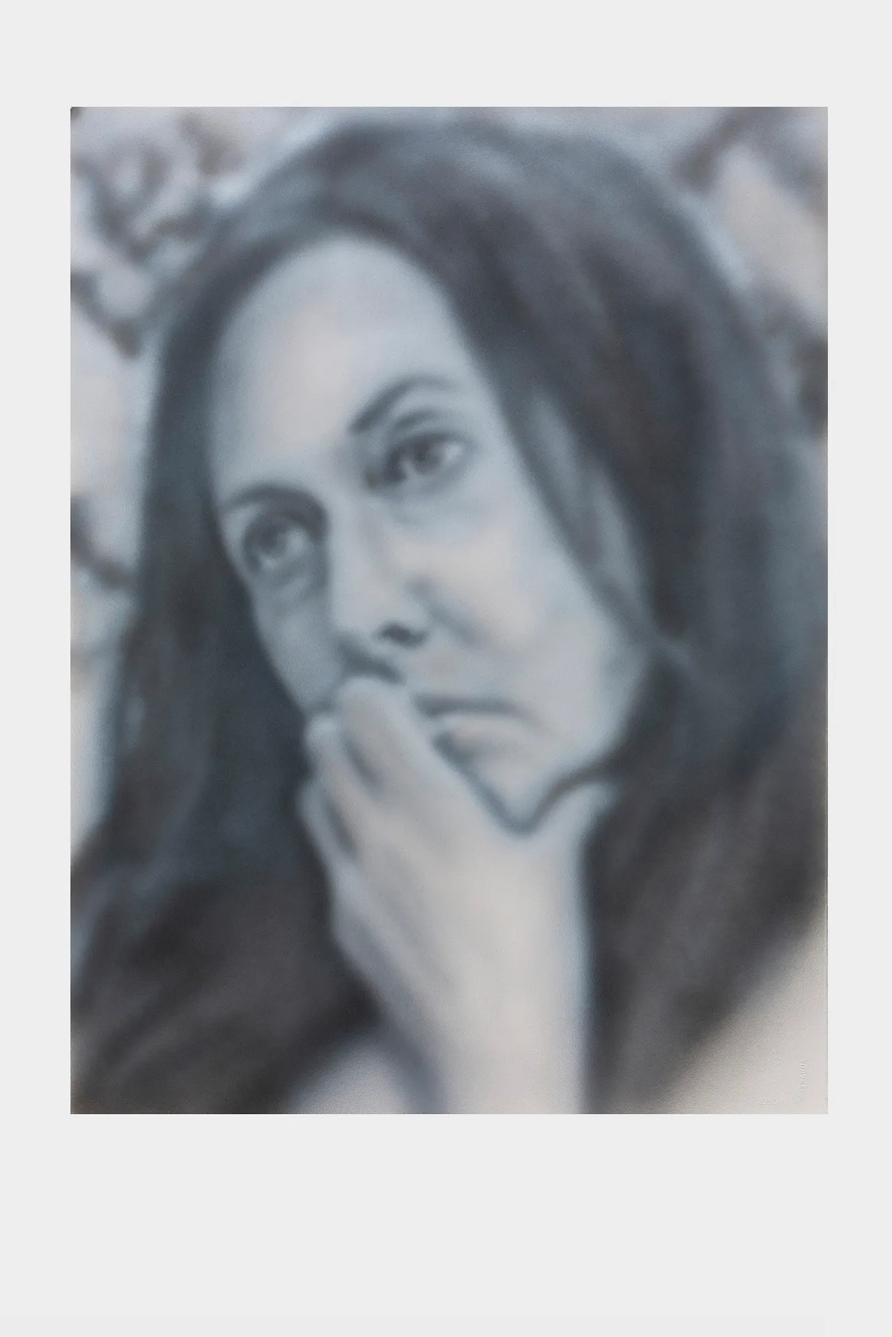 Black and white image of a lady lost in thought