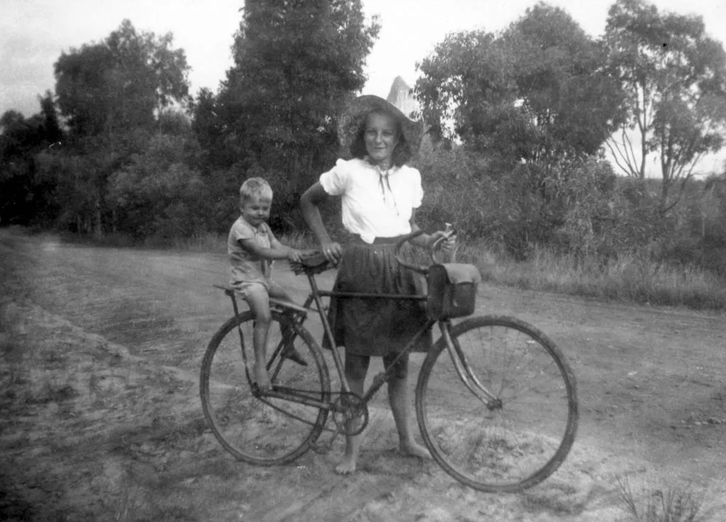 Ethel-Burgess-taking-her-brother-Graham-for-a-short-bike-ride-Glass-House-Mountains-January-1949-copy-1-1024x737.jpg