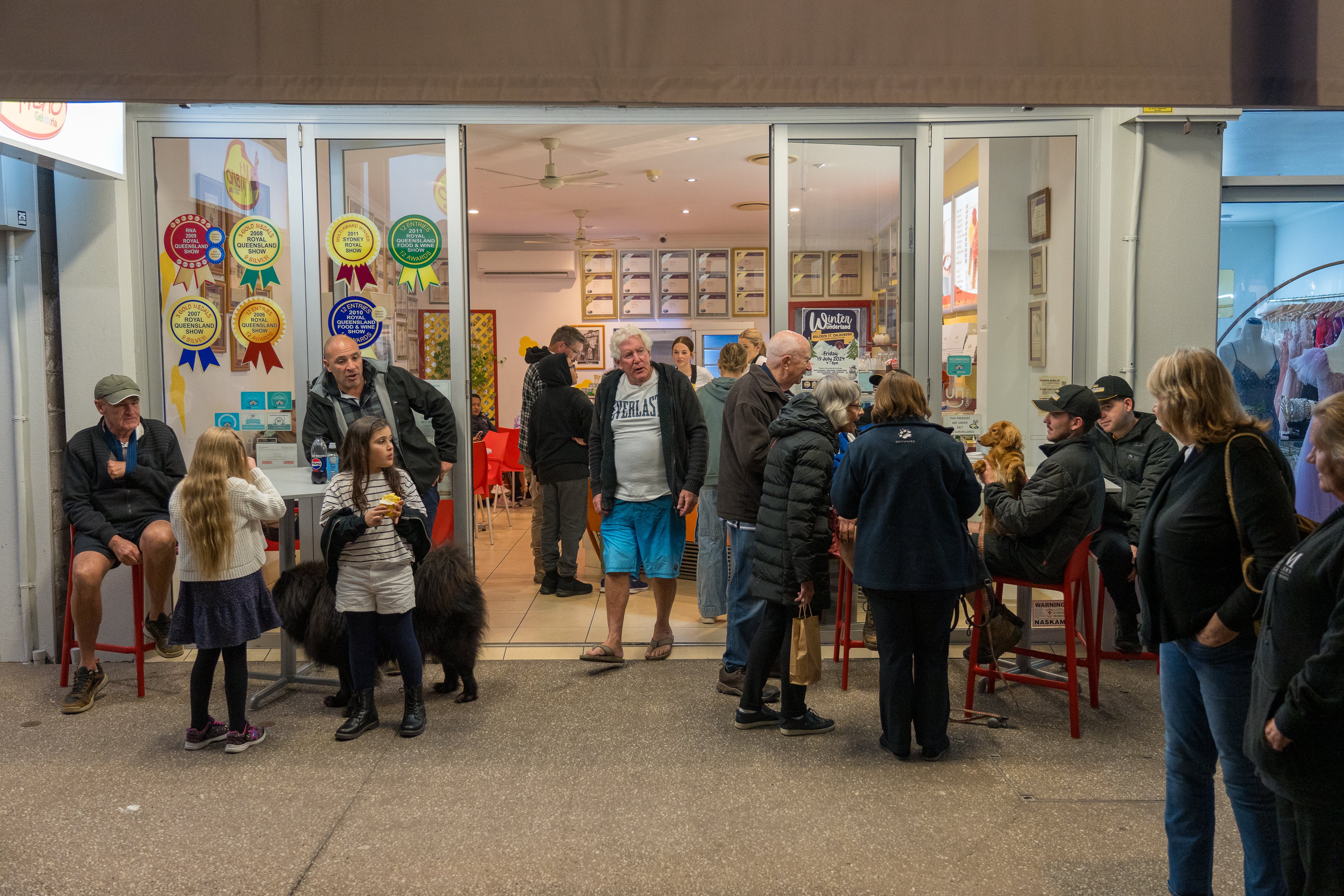 People milling around outside a local business