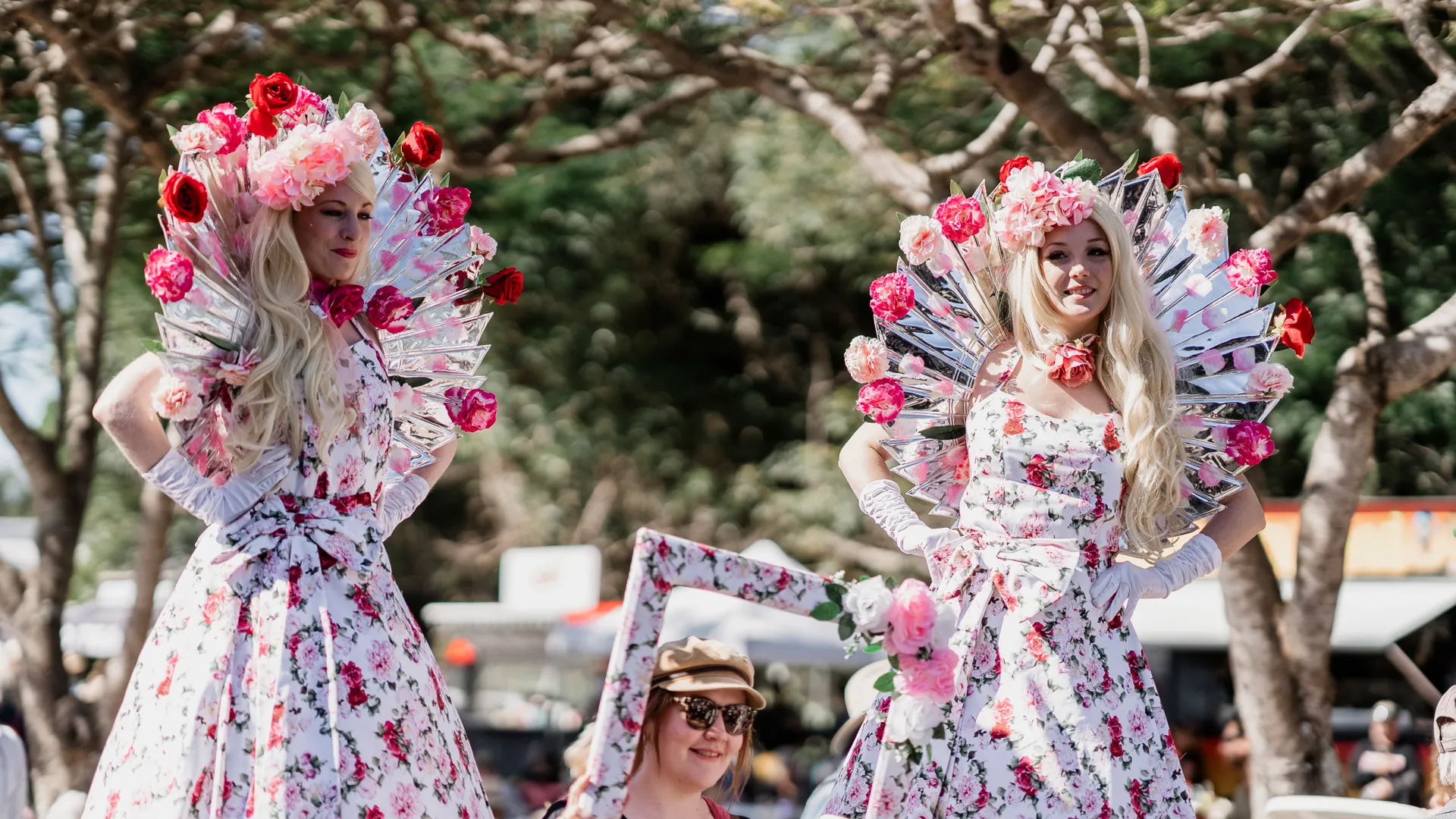 Bright and colourful stiltwalkers wander the expo. 
Image credit: QGE - Jordan Clune