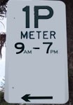 Timed parking sign with arrow pointing left.