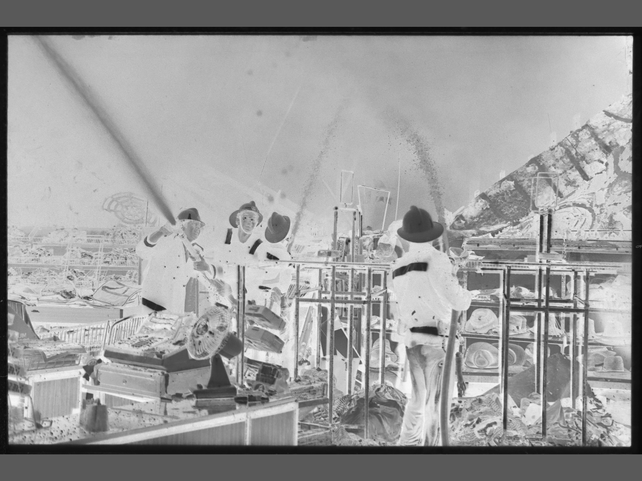 Woolworths fire, Nambour-Fireman fighting fire with hoses inside building in 1985.