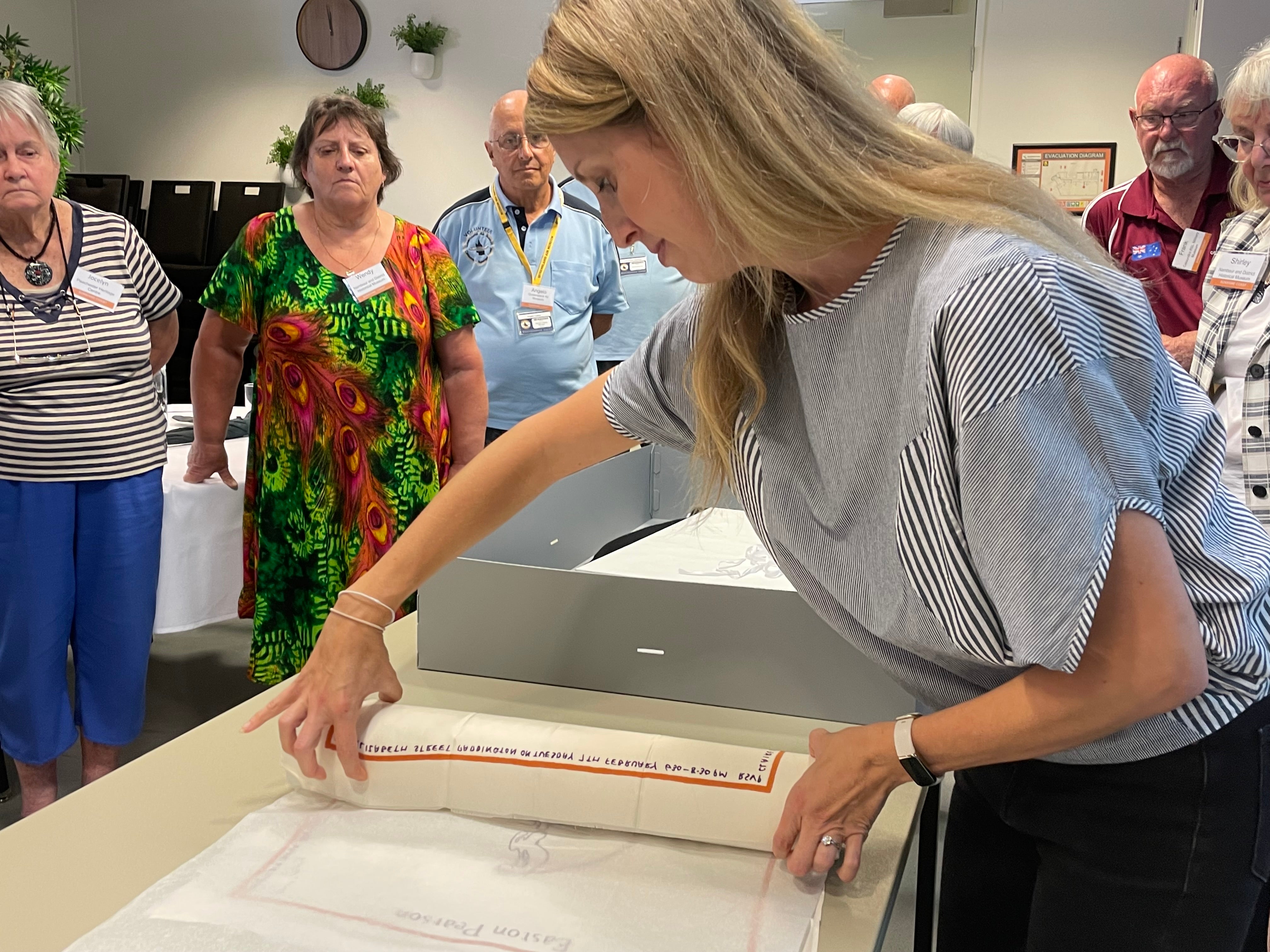 conservator demonstrates textile conservation