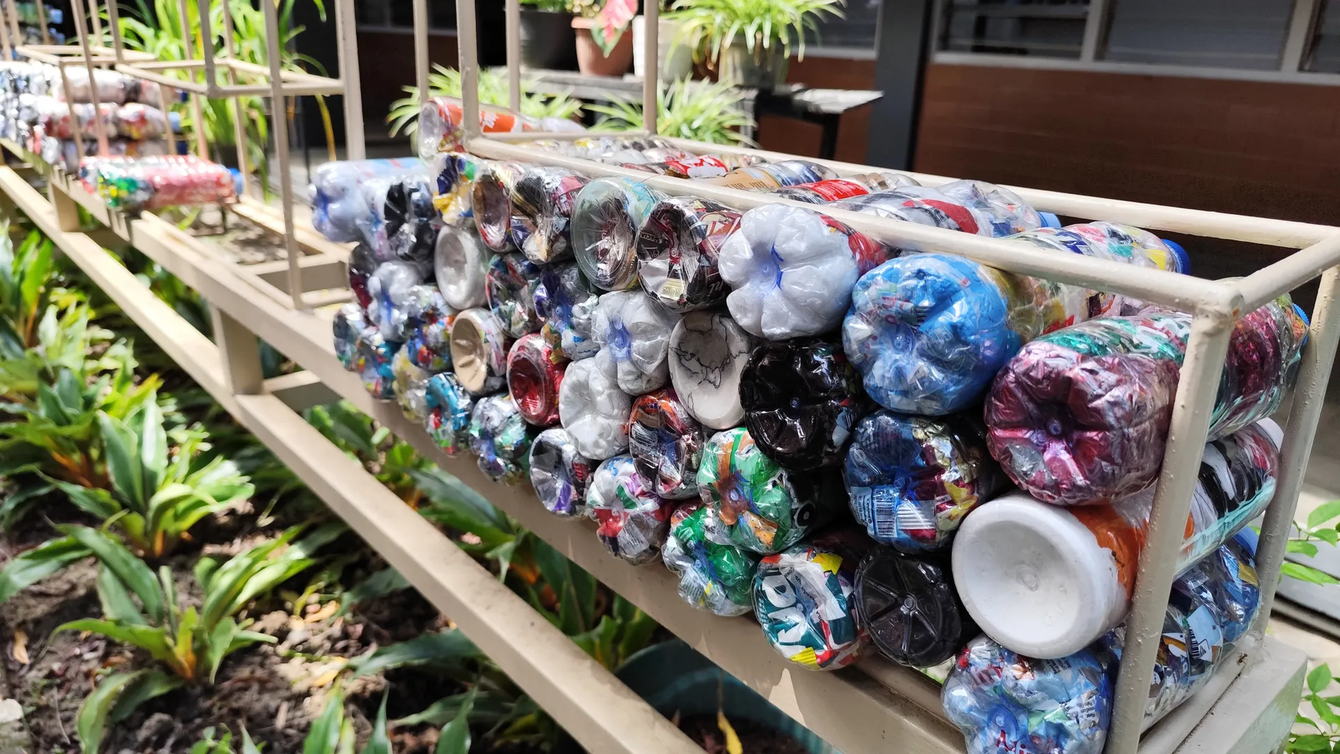 a wall made using ecobricks - plastic bottles stuffed with soft plastics.