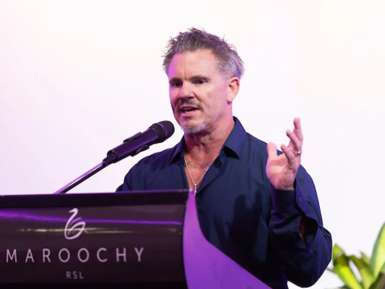 Dr Leon Stensholm speaks at an event.