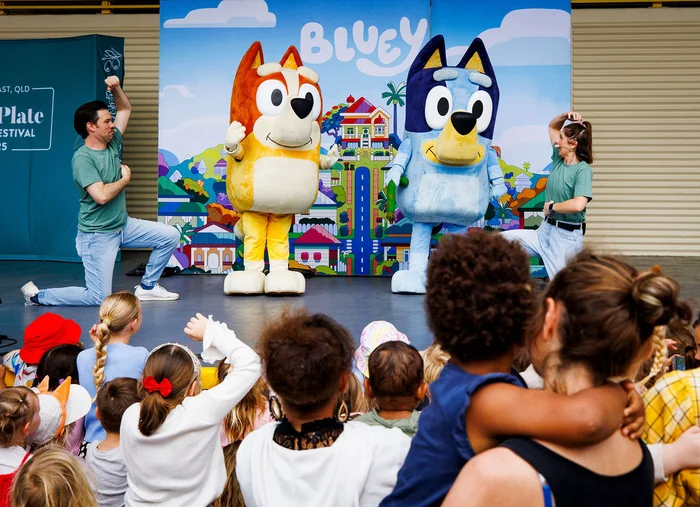 Kids characters Blue and Bingo on stage with two fellow entertainers