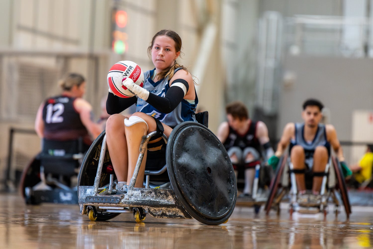 A parasport athlete holding a ball