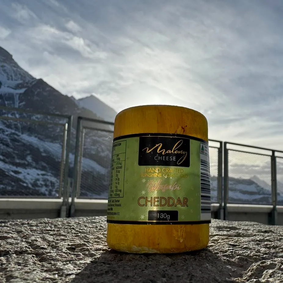 A picture of Maleny Cheese in the foreground, and behind the alps of Switzerland