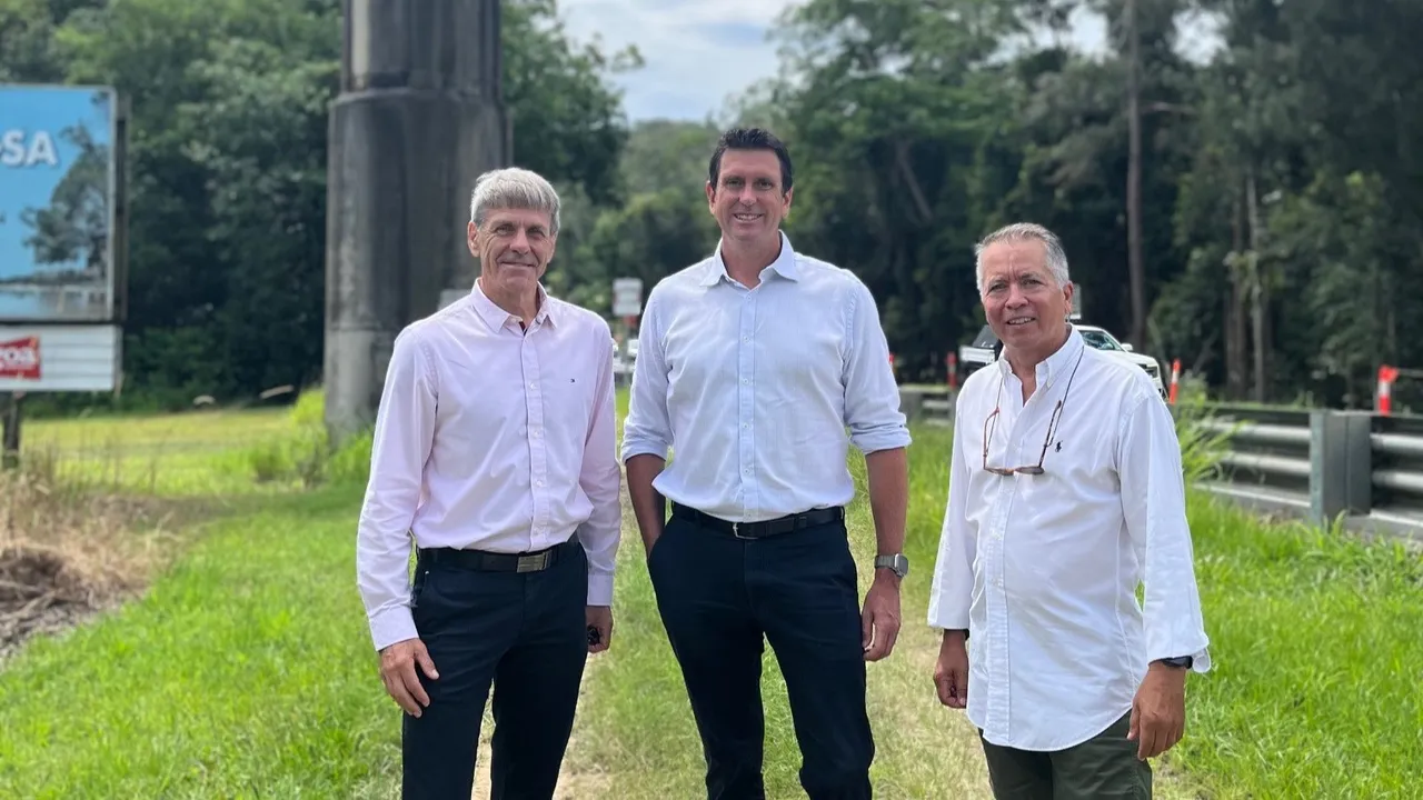 Cr David Law, MP Dan Purdie and community advocate David Perez stand together in business attire along Seib Road.