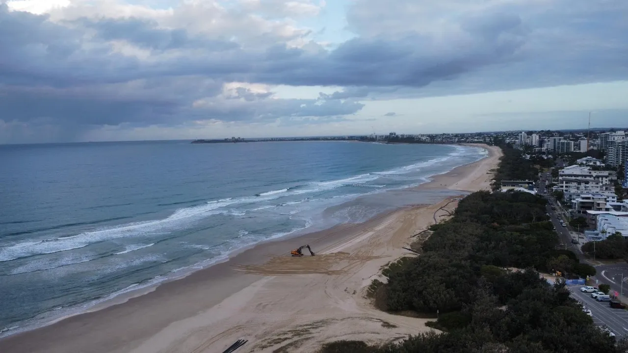 view of the beach with excavator