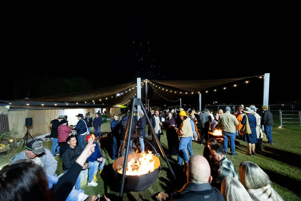 People standing around a firepit