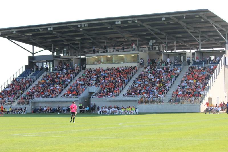 A picture of the Sunshine Coast Stadium grandstand filled with Brisbane Roar supporters.