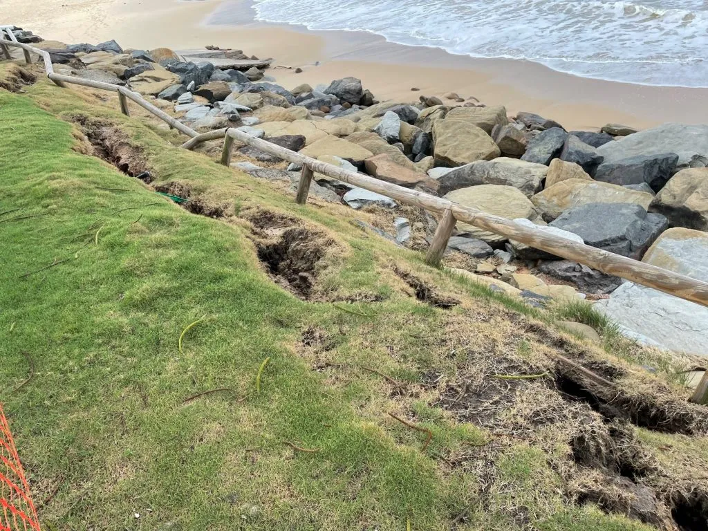 Cracking and damage to the Moffat Beach Seawall.