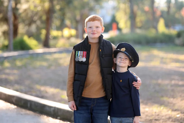 Legacy Australia represented by two boys with service uniform
