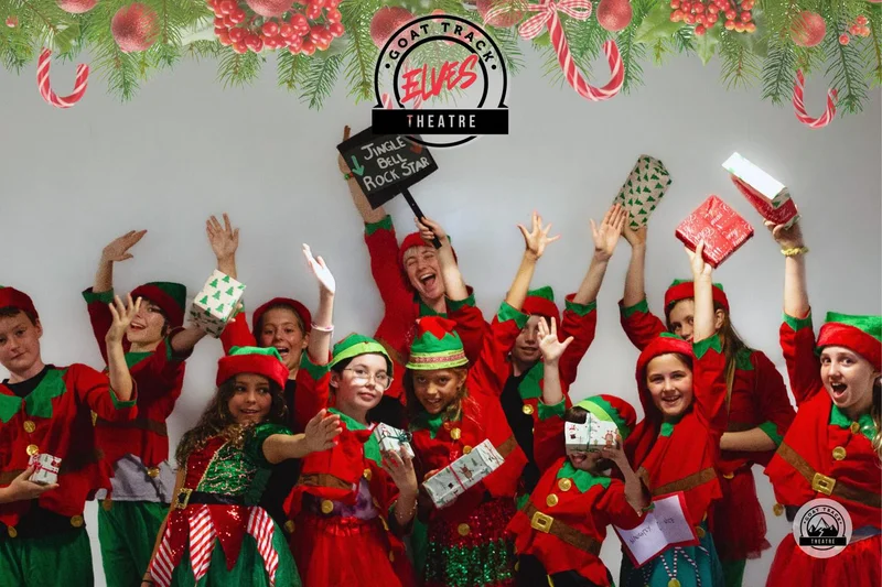 Elves with their hands up and or holding gifts.