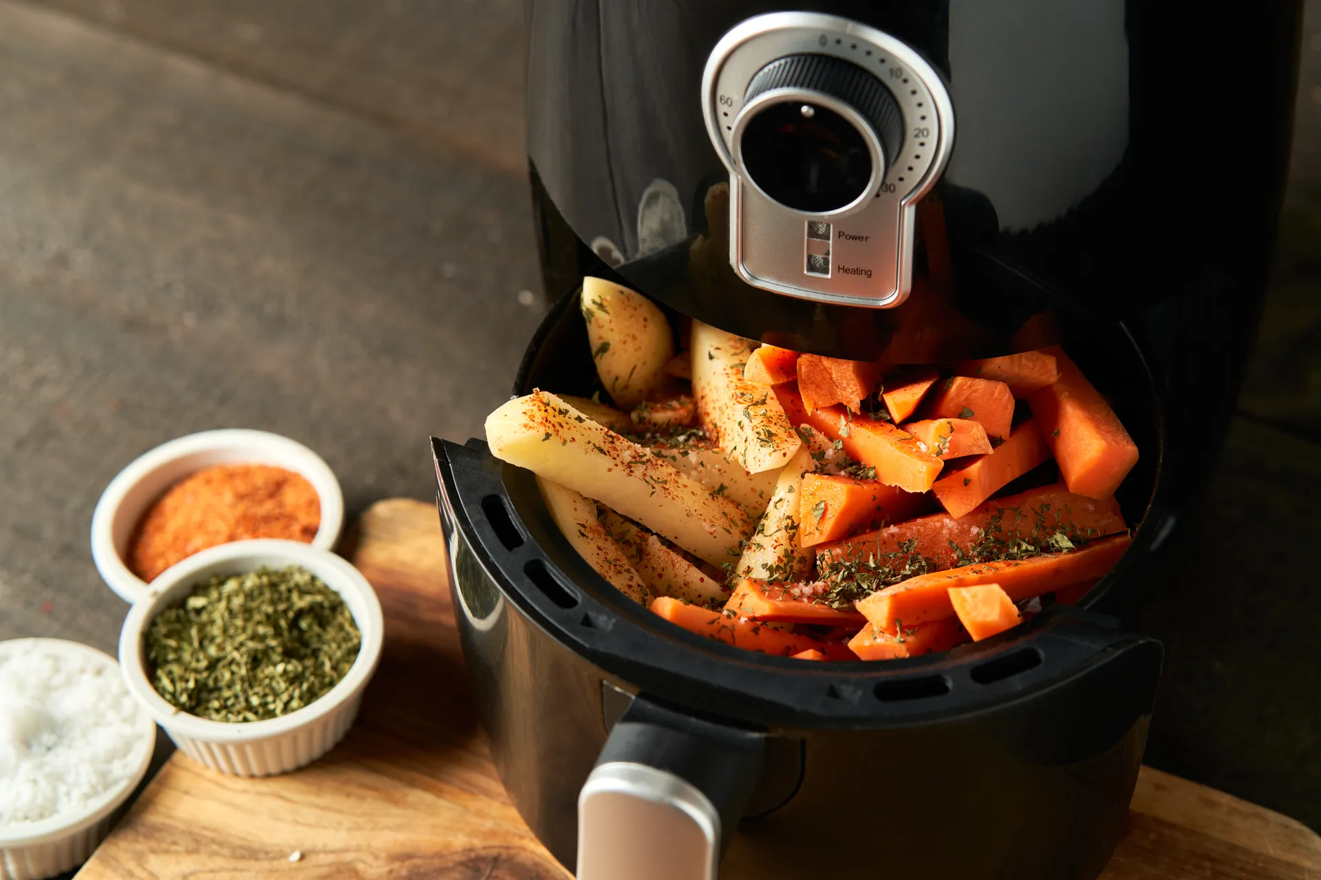Air Fryer filled with chips and carrot sticks