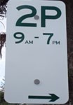 Timed parking sign with arrow pointing right.