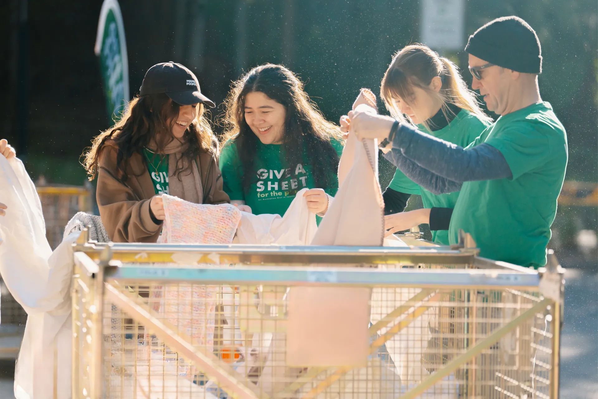 Volunteers sorting through donation bin