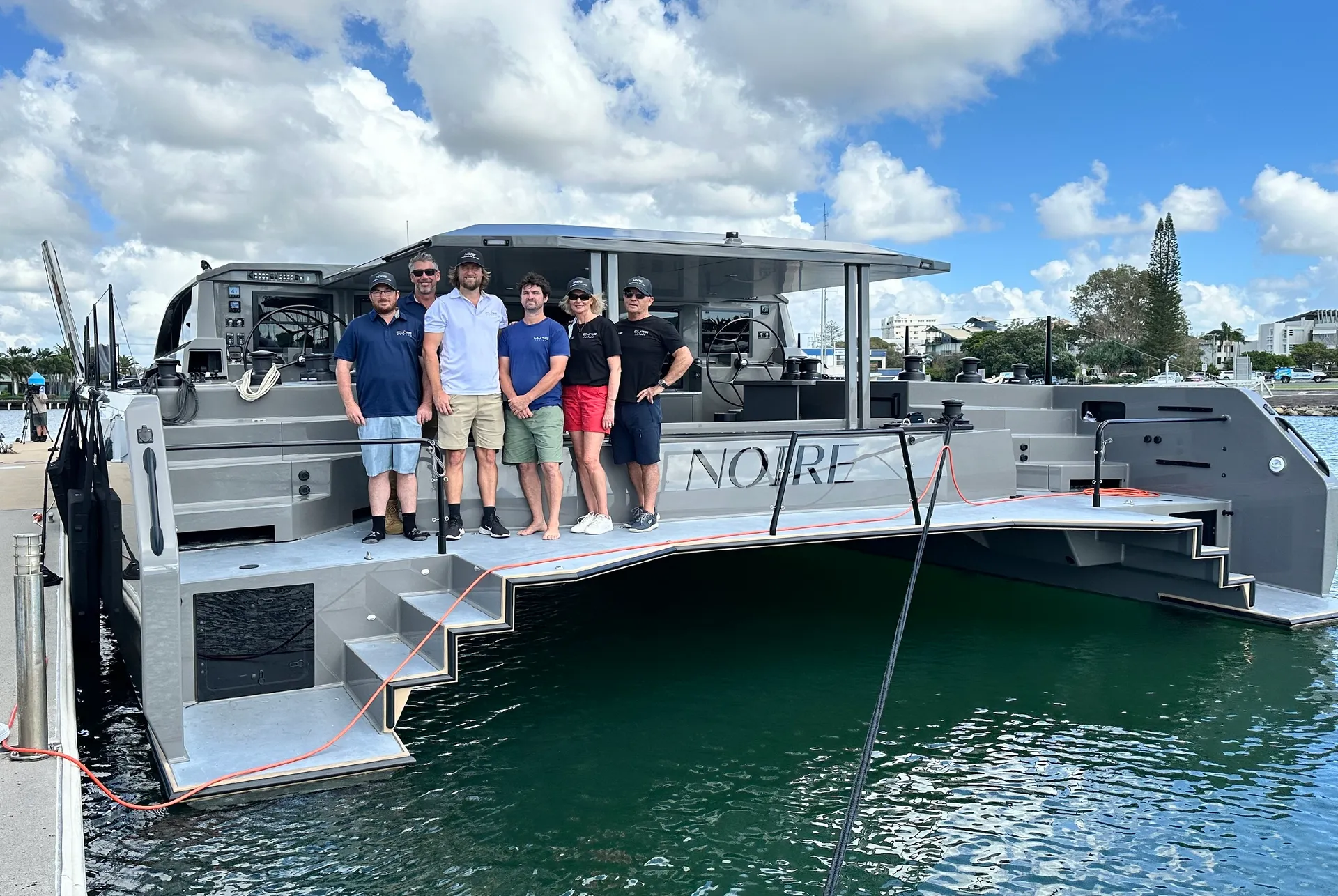 Cure Marine CEO Carl Bird and team with new owners Allan and Michele Larkin.