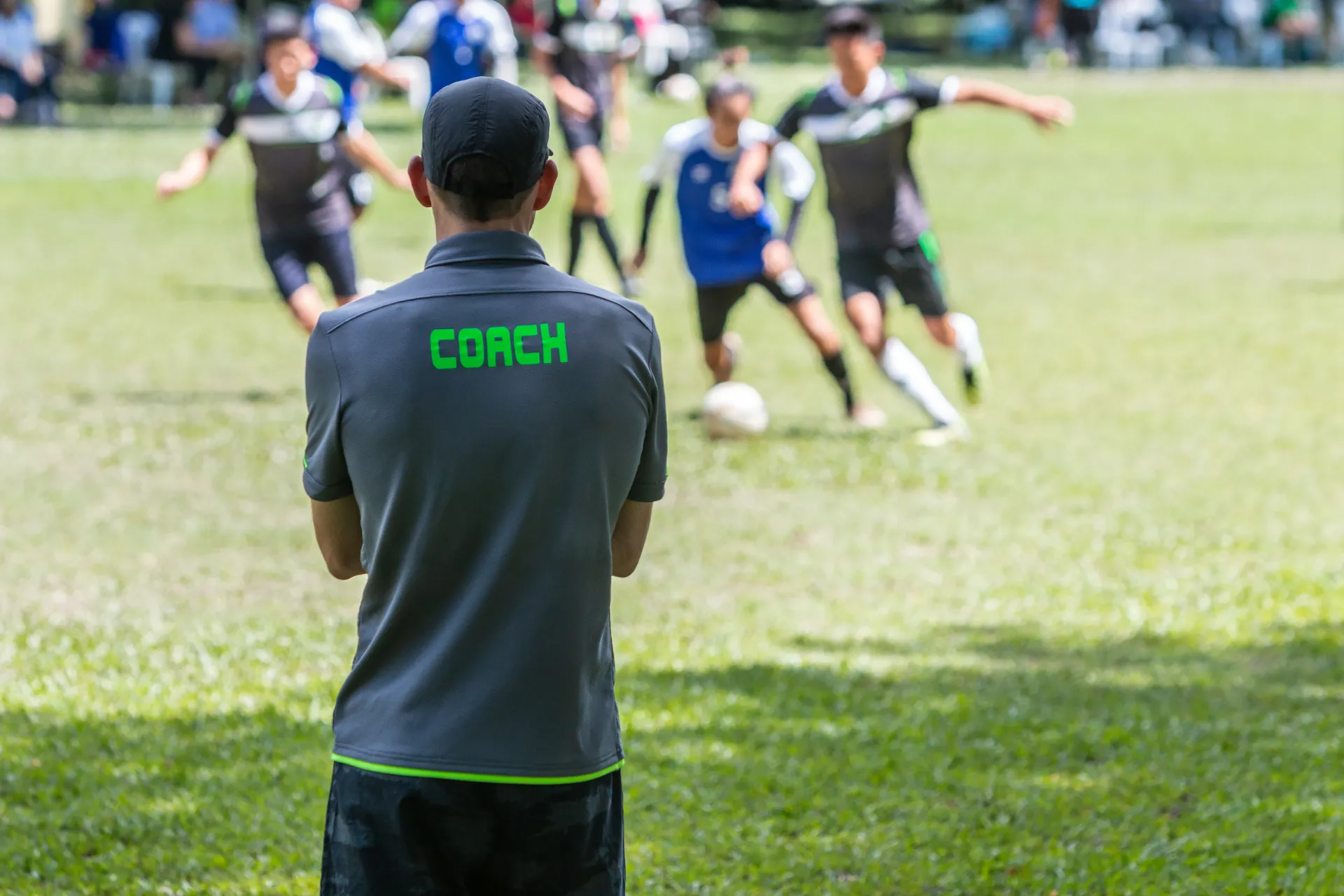 Soccer coach watching a game