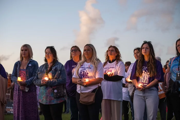 Community unites for march and candlelight vigil