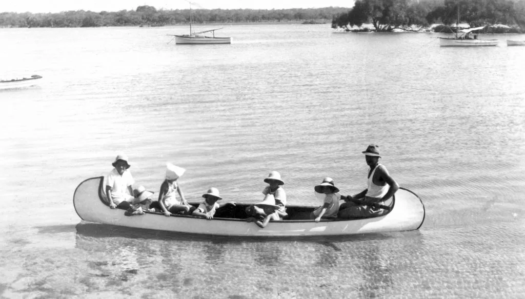 Ted-Pacey-rowing-children-in-his-canoe-Mooloolah-River-Mooloolaba-ca-1950-copy-1-1024x583.jpg