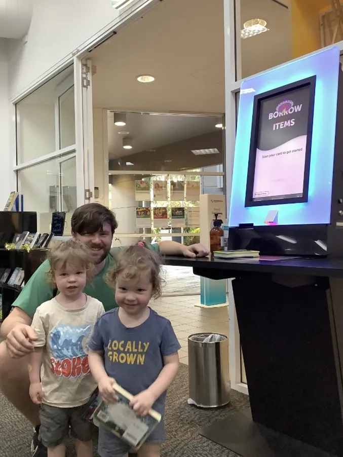 Father and sons at Beewah Library