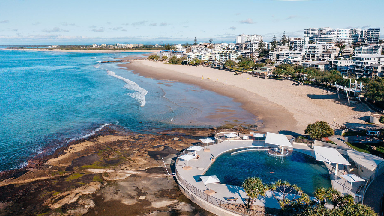 Aerial shot of King's Beach with the Ocean Pool in front