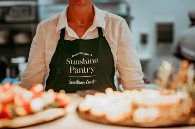 Chef wearing a Sunshine Pantry apron