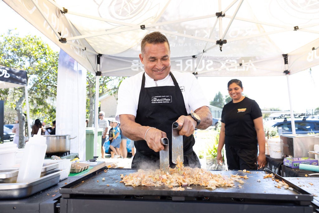 Chef Peter Kuruvita cooking on a hot plate