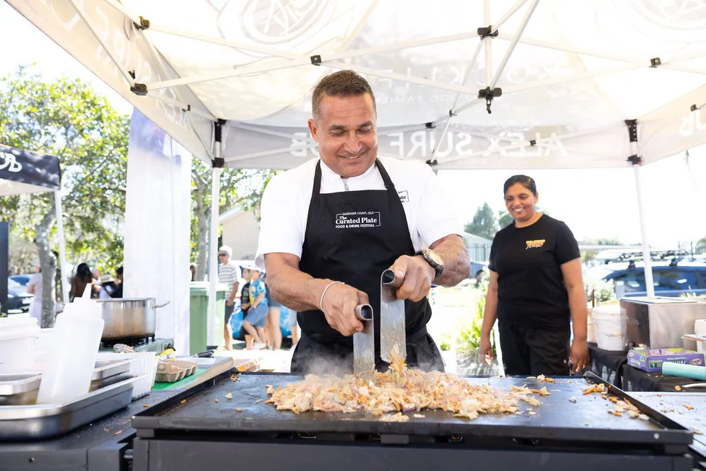 Chef Peter Kuruvita cooking on a hot plate
