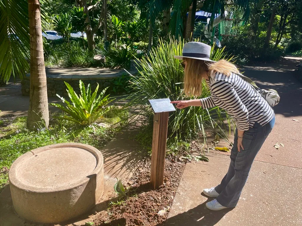 Visitor reading the story of The Monts